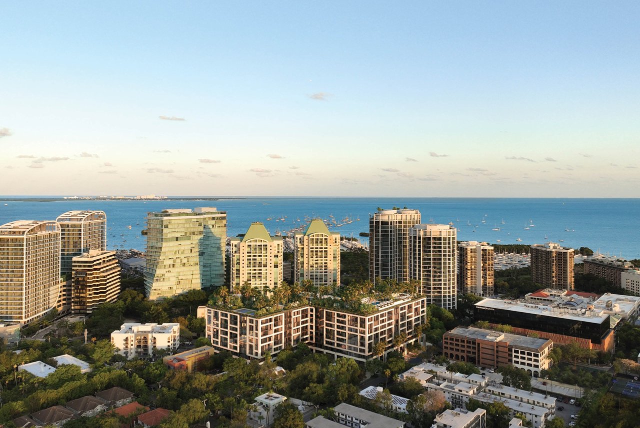 The Well development beside Biscayne Bay, with landscaped rooftops and boats offshore.