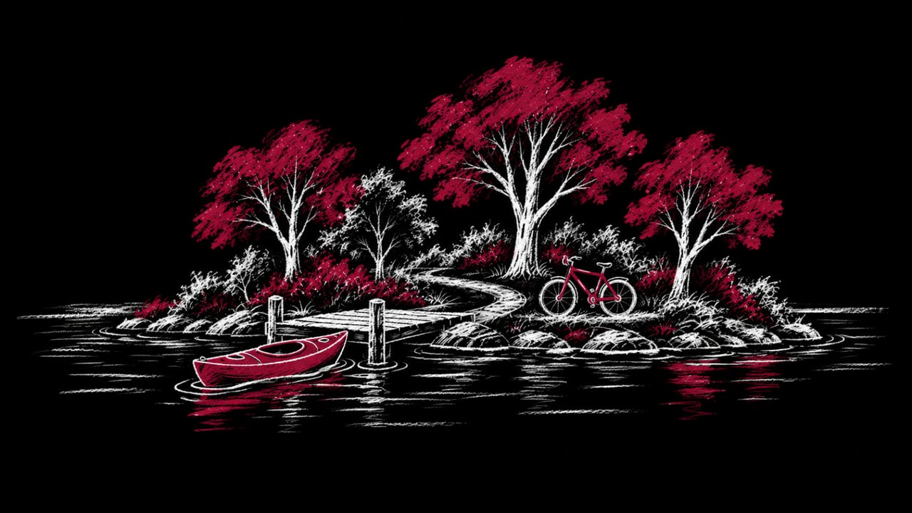 Illustration of a river island park with a kayak at a launch dock and a bicycle on a path, for what the city finished on North Island in Wilmington, Illinois in 2026 and the fall events there.