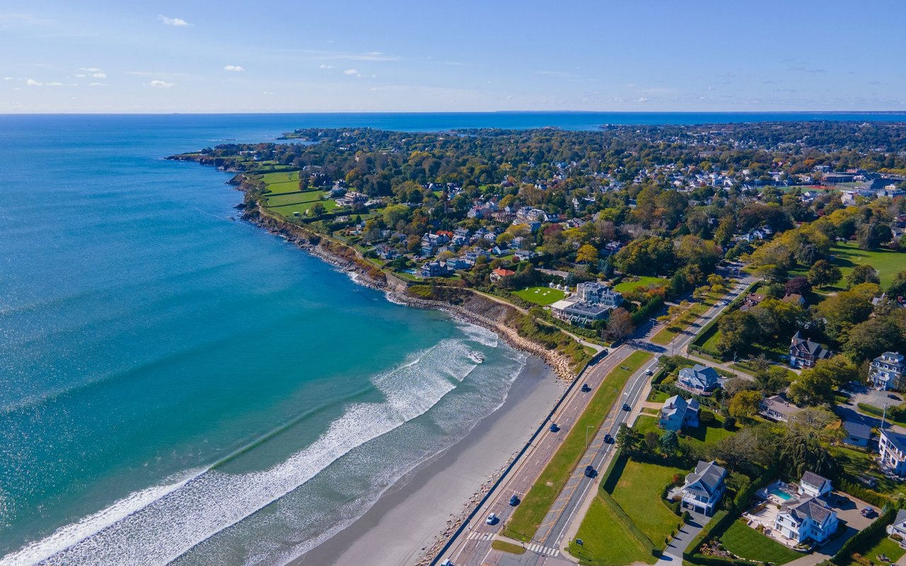 Aerial view of Middletown’s coastline, with a beach, ocean, and homes along the shore.