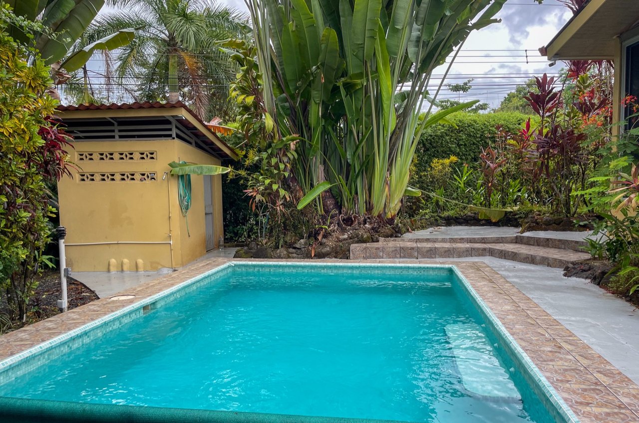 Cozy Colonial Home with Lush Gardens and Prime Commercial Prospects