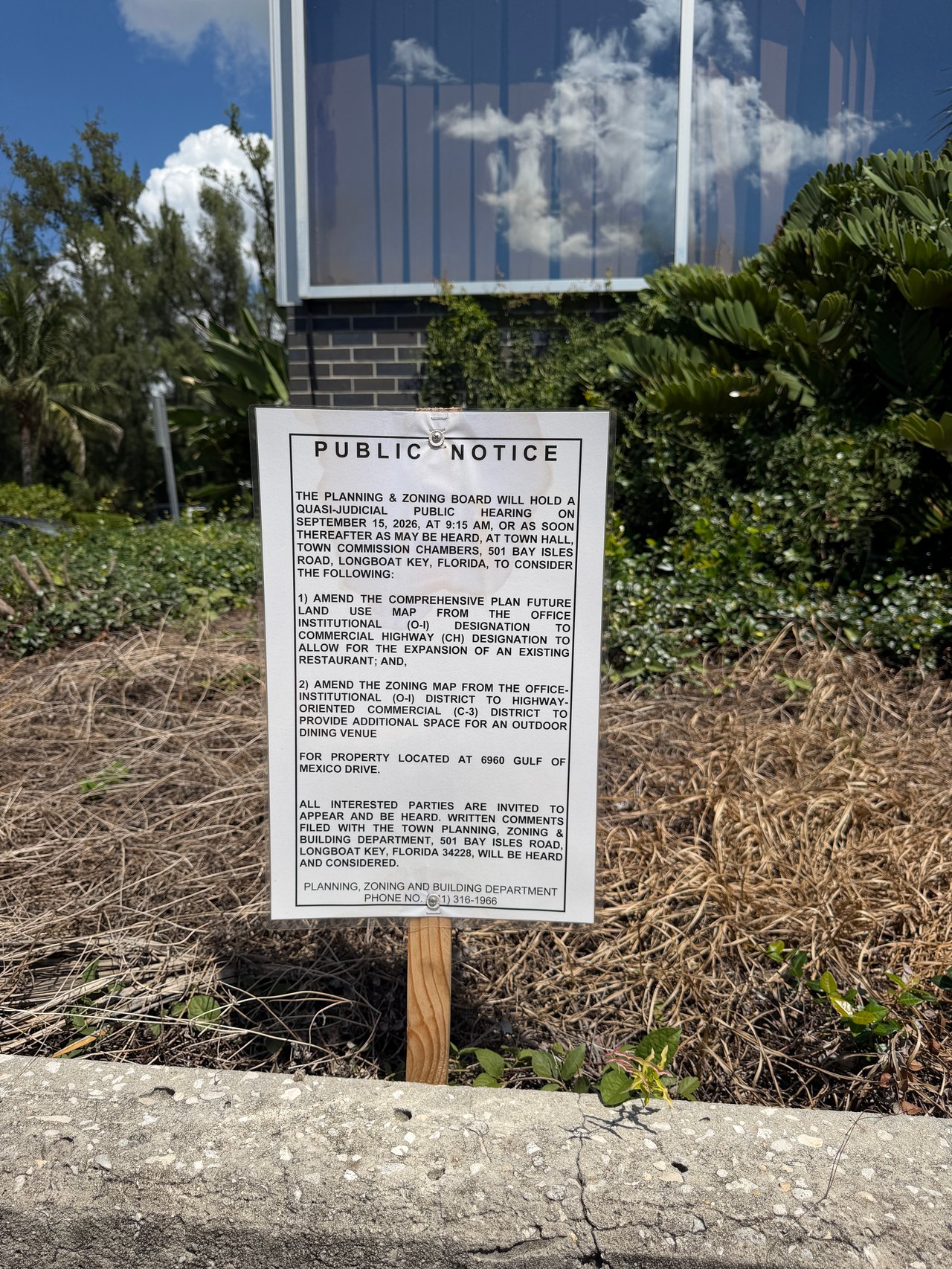 Public notice for a Longboat Key hearing on restaurant expansion and outdoor dining at 6960 Gulf of Mexico Drive.