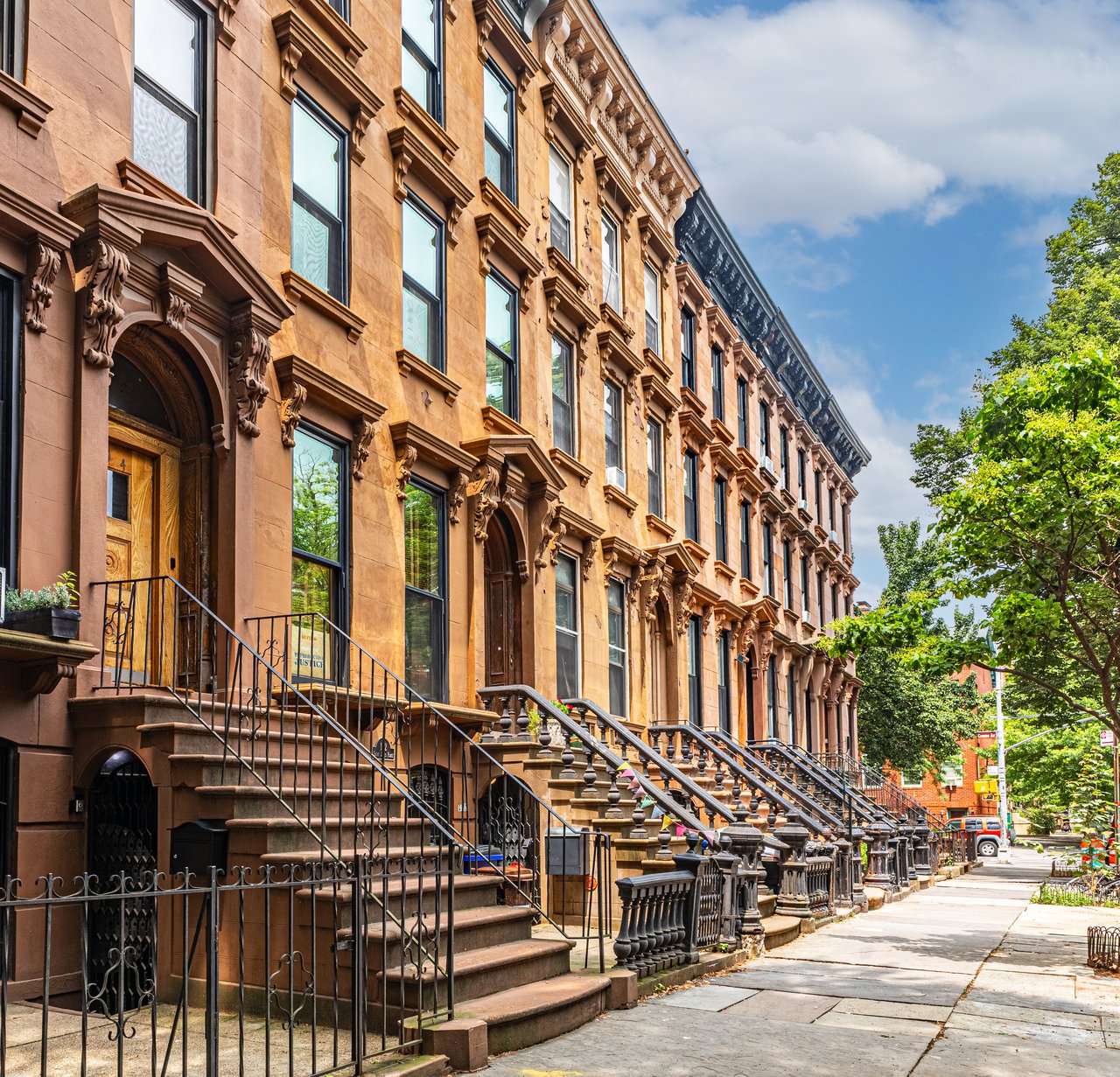 Historic brownstones, townhouses, and multifamily homes along Vernon Avenue in Bedford-Stuyvesant, Brooklyn.