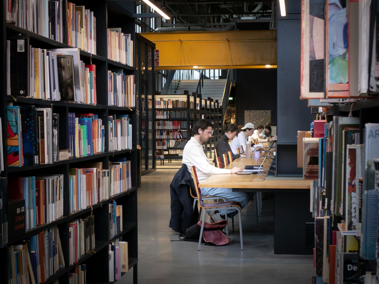 Students studying together in a modern library