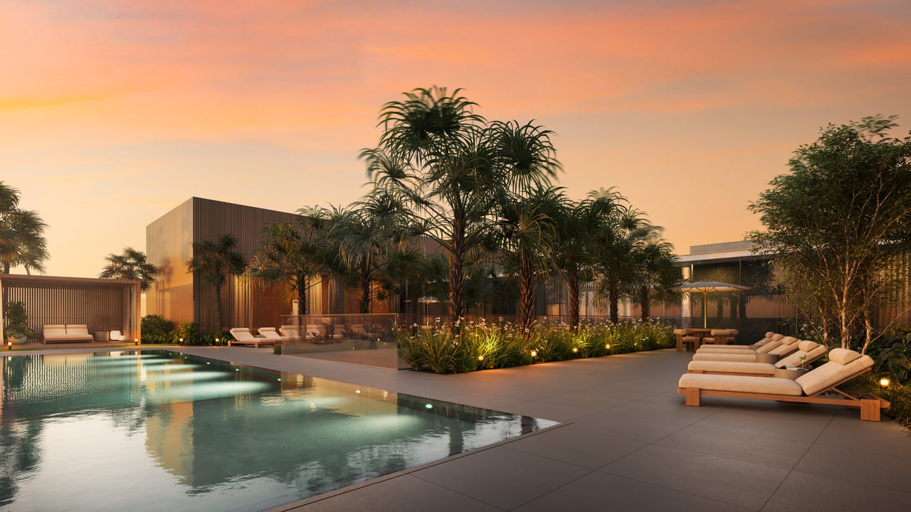 Rooftop pool and sun deck at Colette Residences with private cabanas, lounge seating, tropical landscaping, and sunset views in South Brickell.