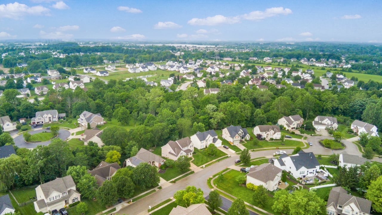 Aerial view of a tree-lined, established neighborhood in Delaware County, Ohio