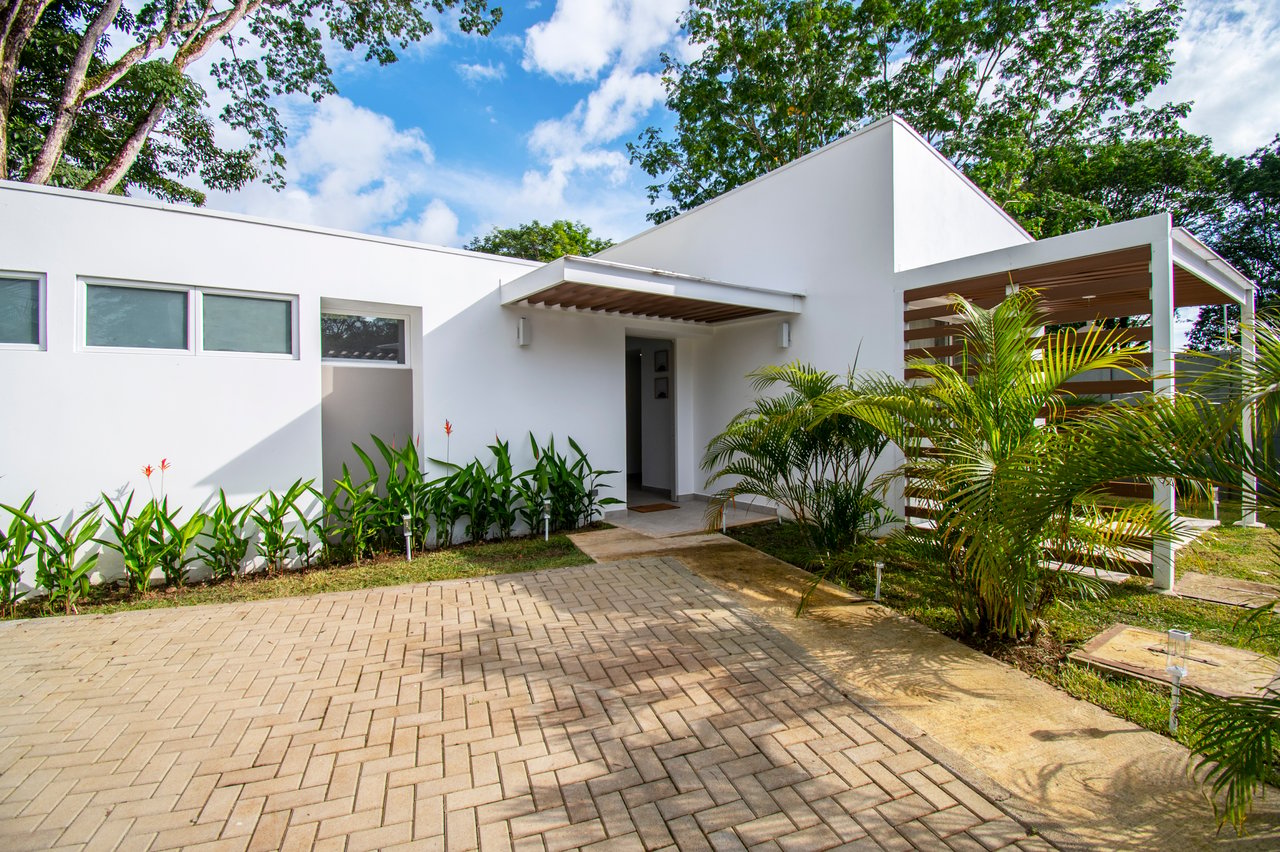Turnkey Tropical Home Steps from the Beach