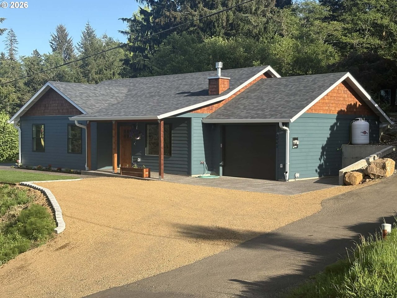 Sold new construction home at 12665 Tohls St in Nehalem, Oregon, with mountain views and buyer representation by Leisha Mizee-Riggert of Home + Sea Realty.