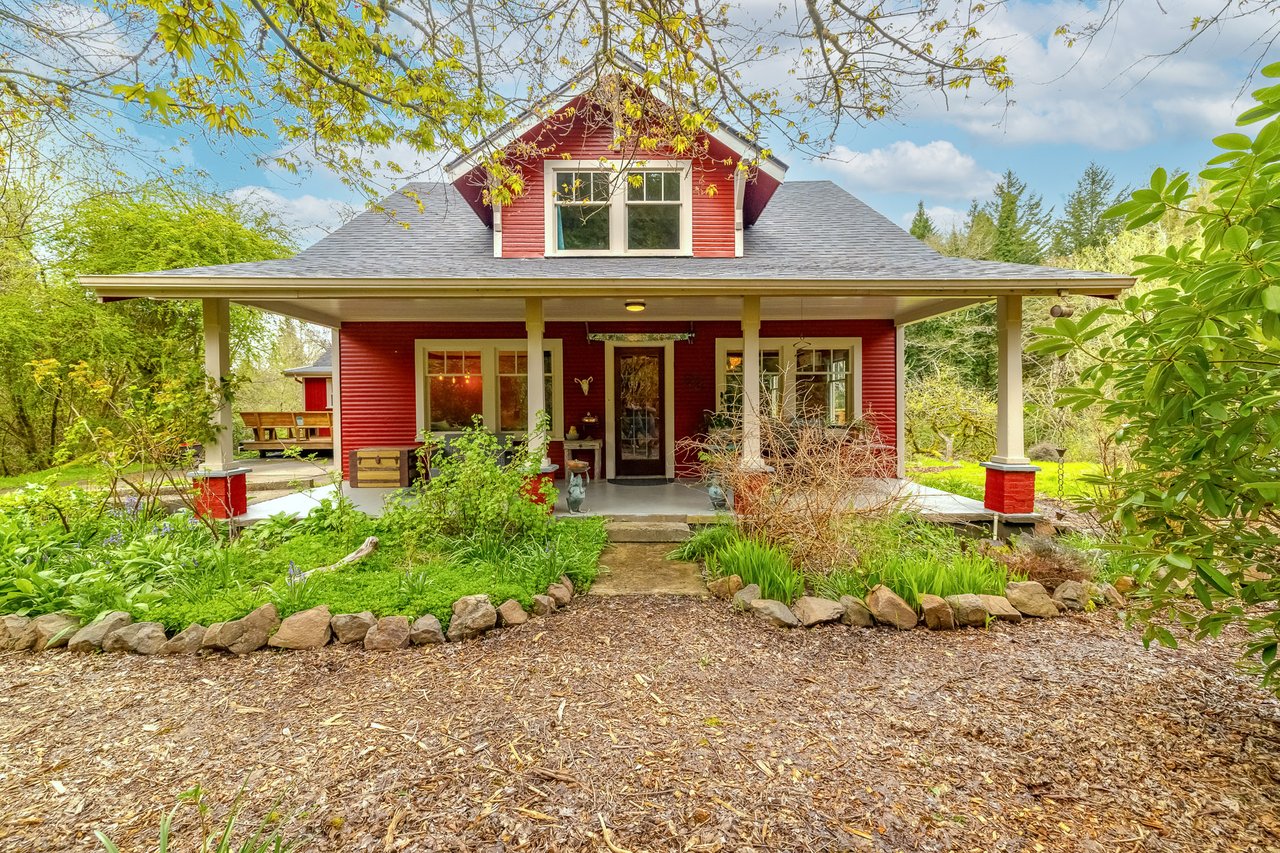 Sold historic riverfront farmstead at 77282 Highway 53 in Nehalem Oregon on the North Fork of the Nehalem River