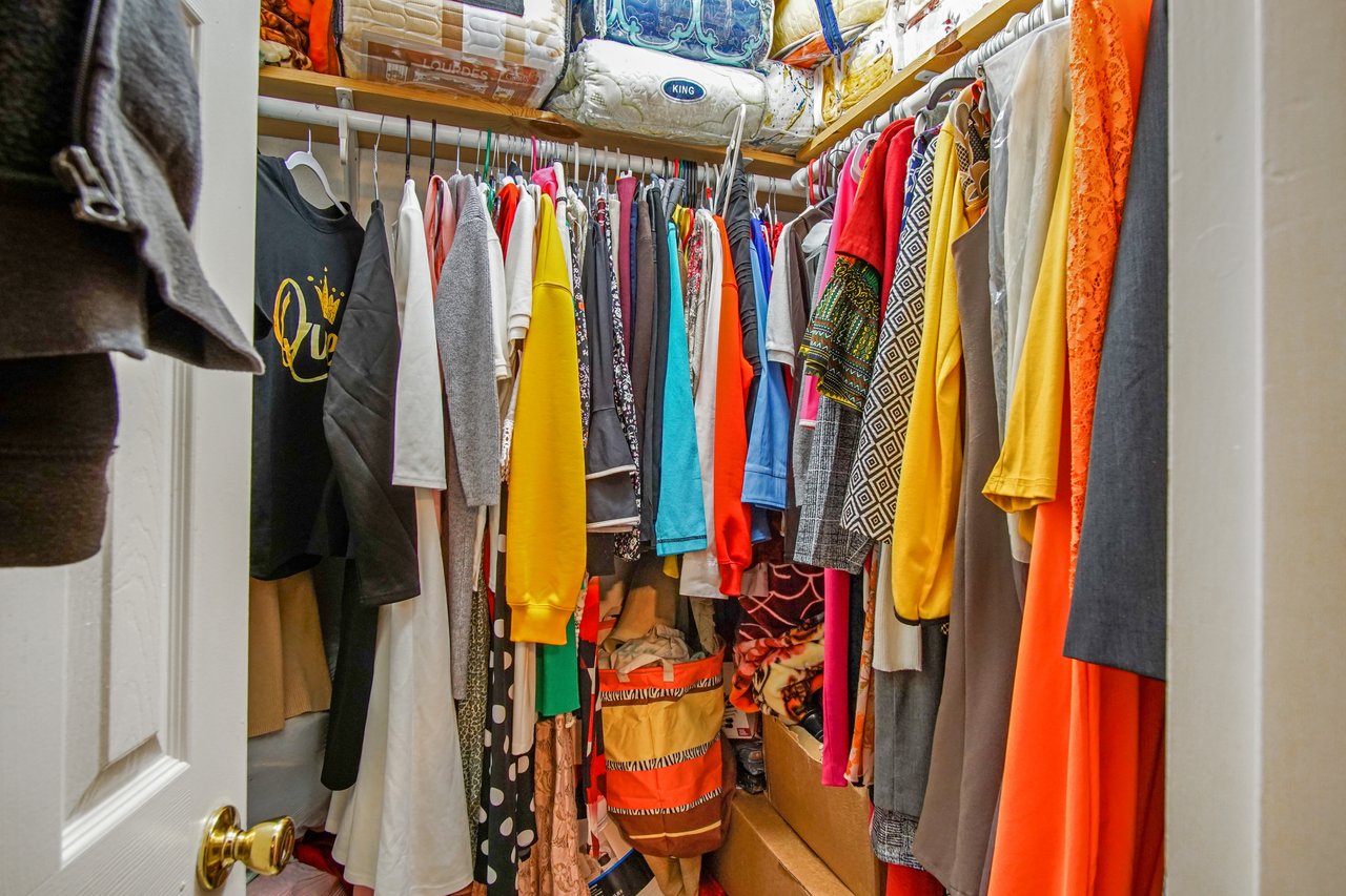 Walk-in closet at 2506 Nugget Lane in Tallahassee, Florida, with tile flooring, hanging rods for clothing, and upper shelving for additional storage. The space provides ample room for organization and wardrobe storage.
