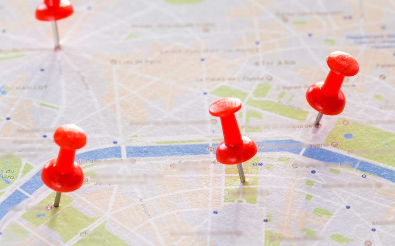 Street map marked with four red pushpins.
