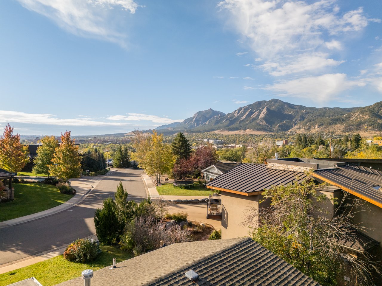 Elevated view south from 2003 Balsam Drive over Hillcrest rooftops toward the Flatirons