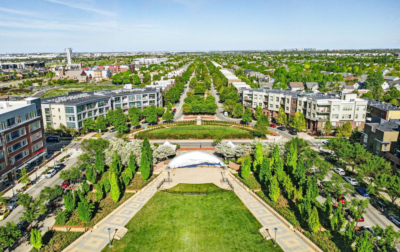 Aerial view of Founders Green in Central Park neighborhood of Denver showing open lawn space and surrounding homes.