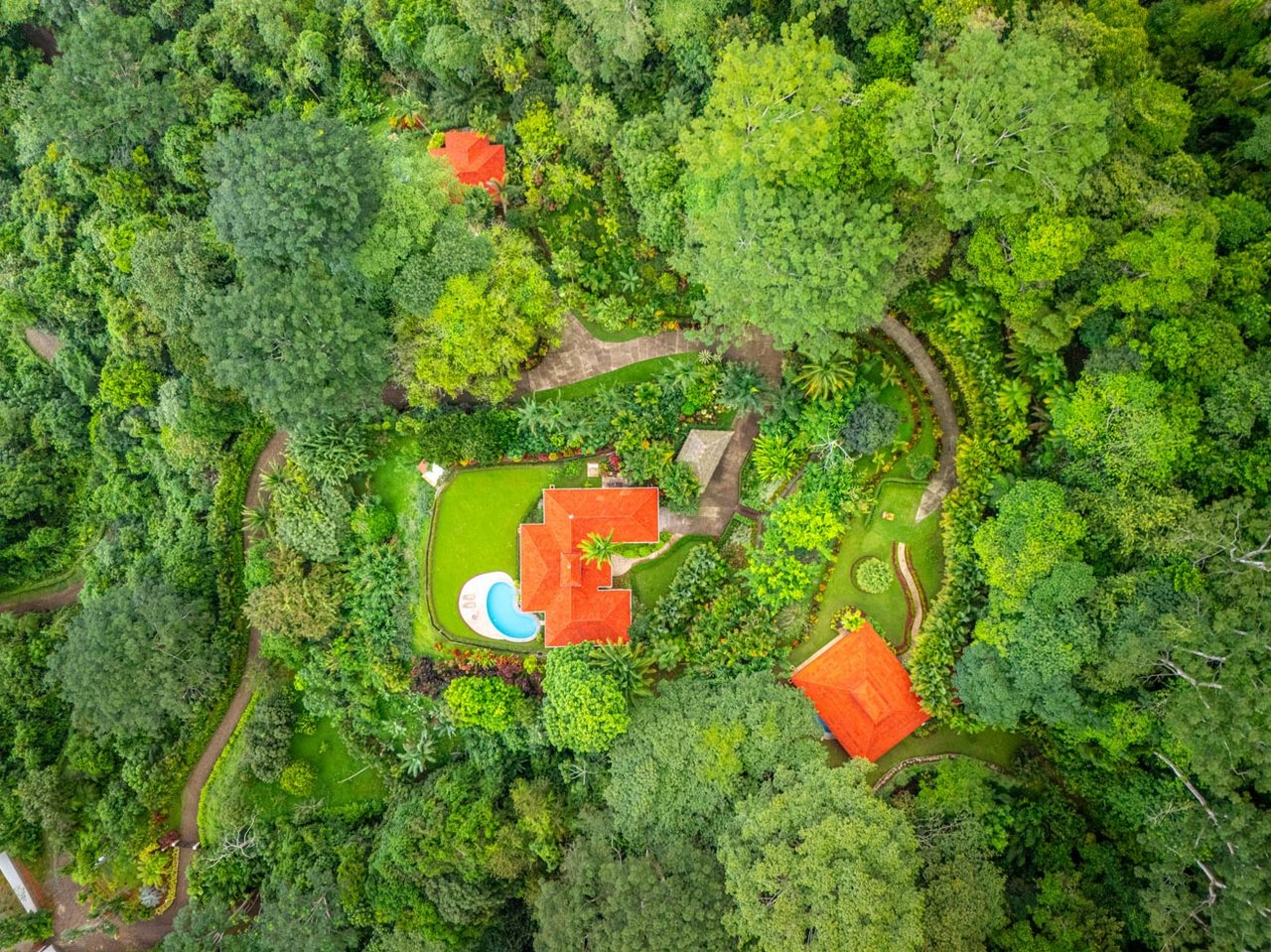 Ocean, jungle & mountain views on a meticulously landscaped 3-home family compound