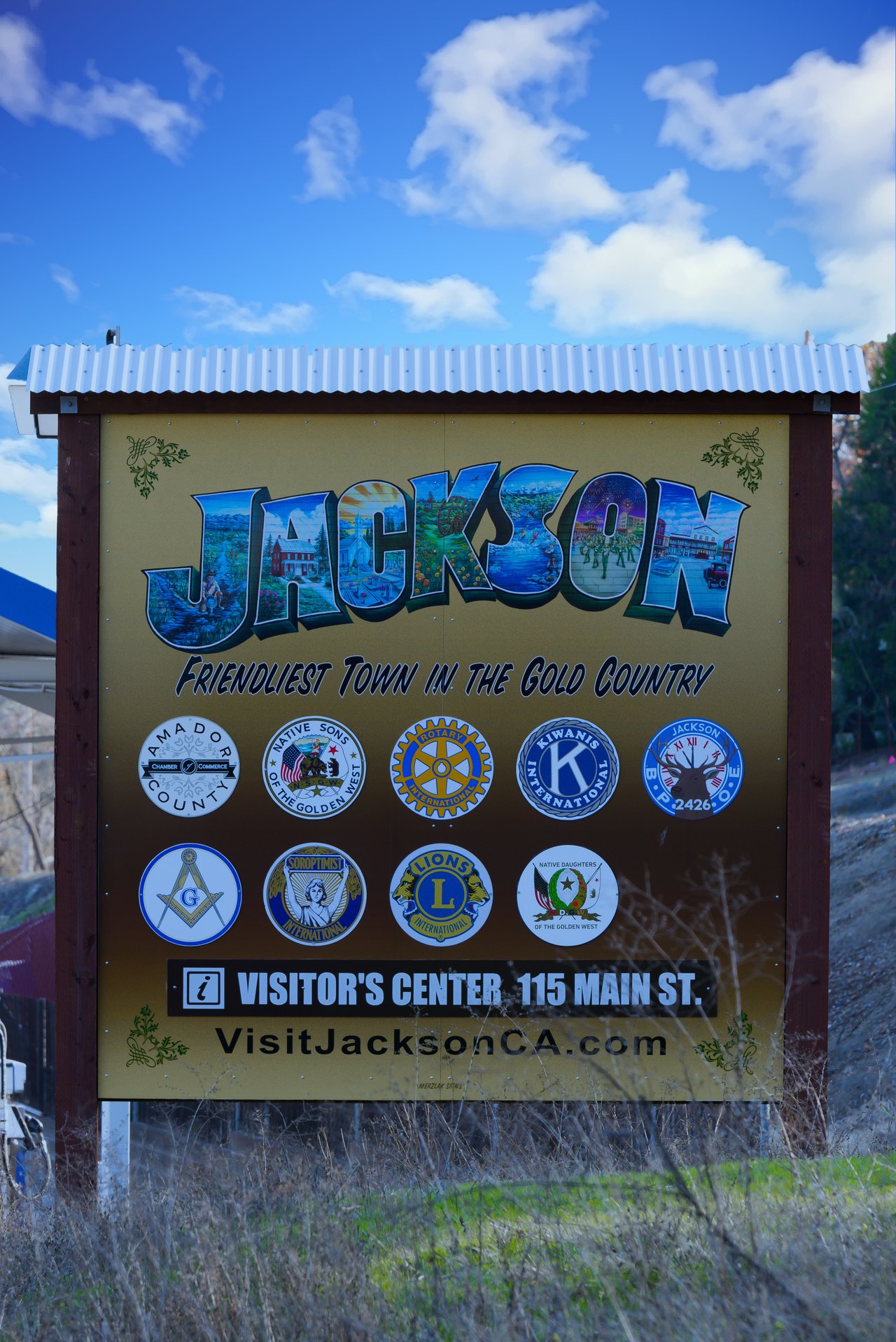 Jackson visitor center sign listing local organizations and the address 115 Main St.