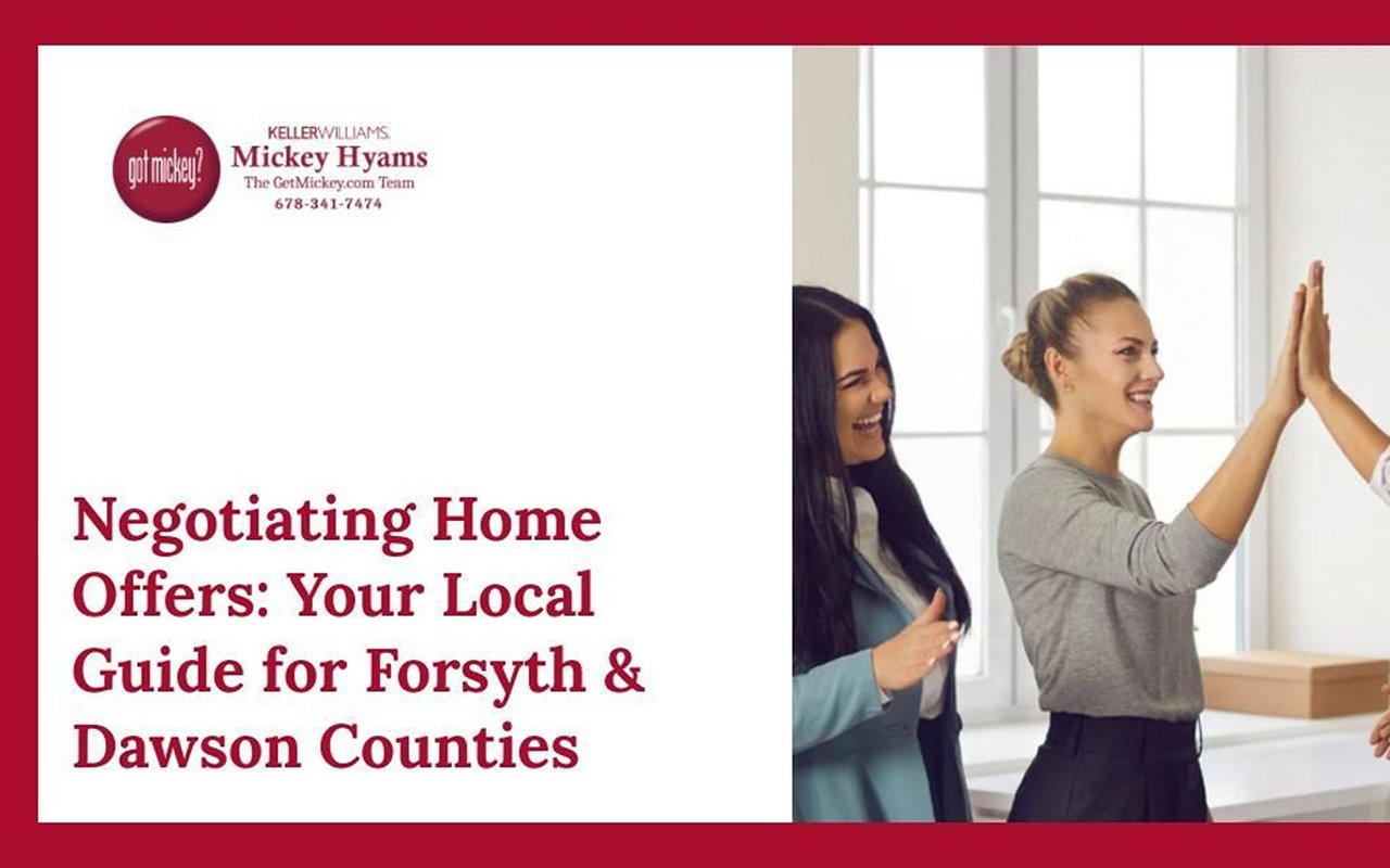 Negotiating home offers in Forsyth and Dawson Counties; two women high-five beside the GetMickey.com Team branding.