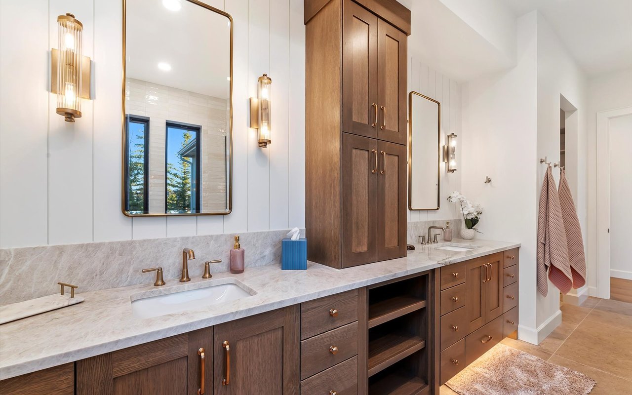 Master bathroom dual vanities with quartz countertops and shiplap walls