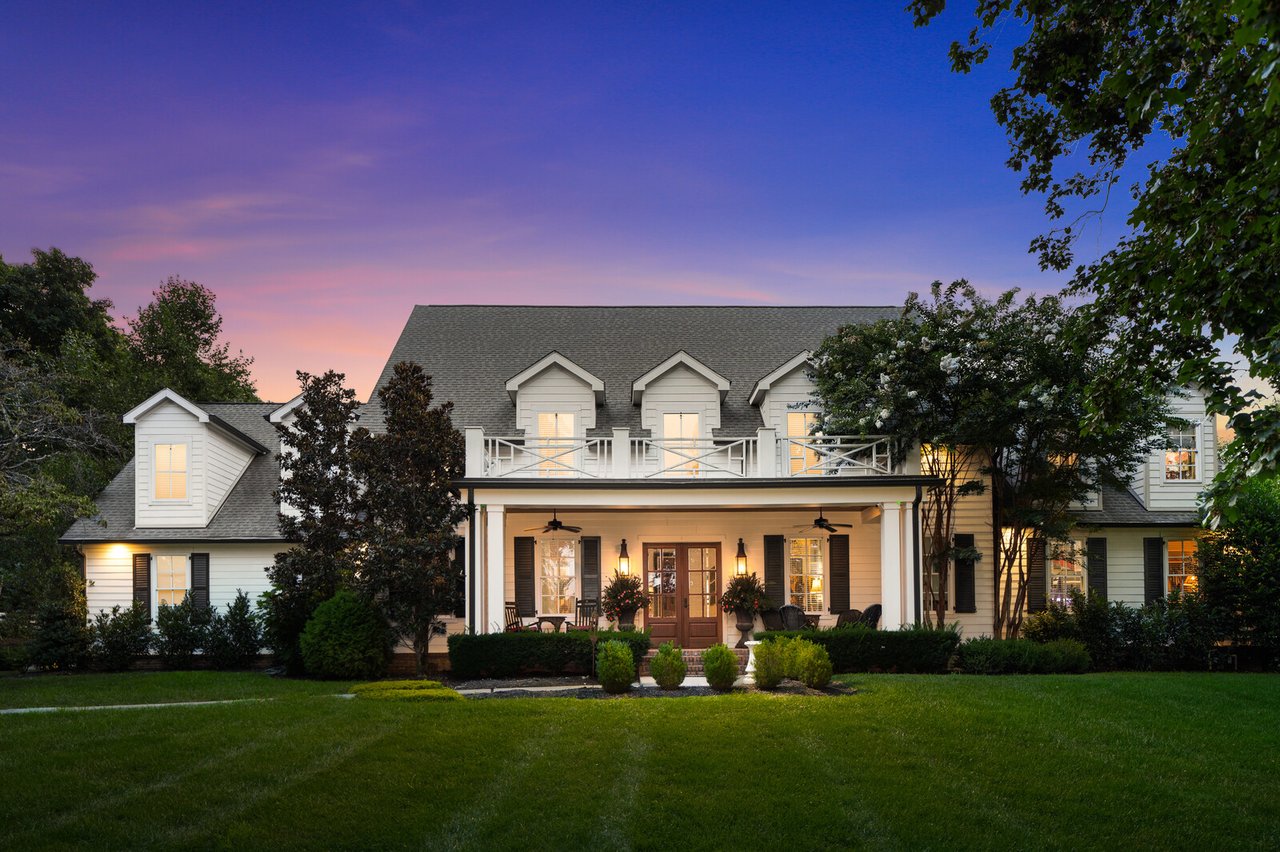 Front exterior of 5566 Hill Rd, Brentwood — classic Southern façade at dusk