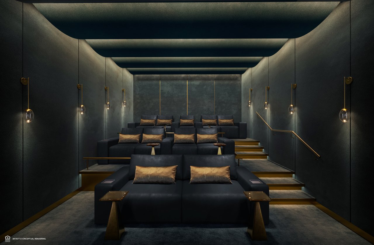 Private screening room with tiered black seats, bronze accents, and dim wall lighting.