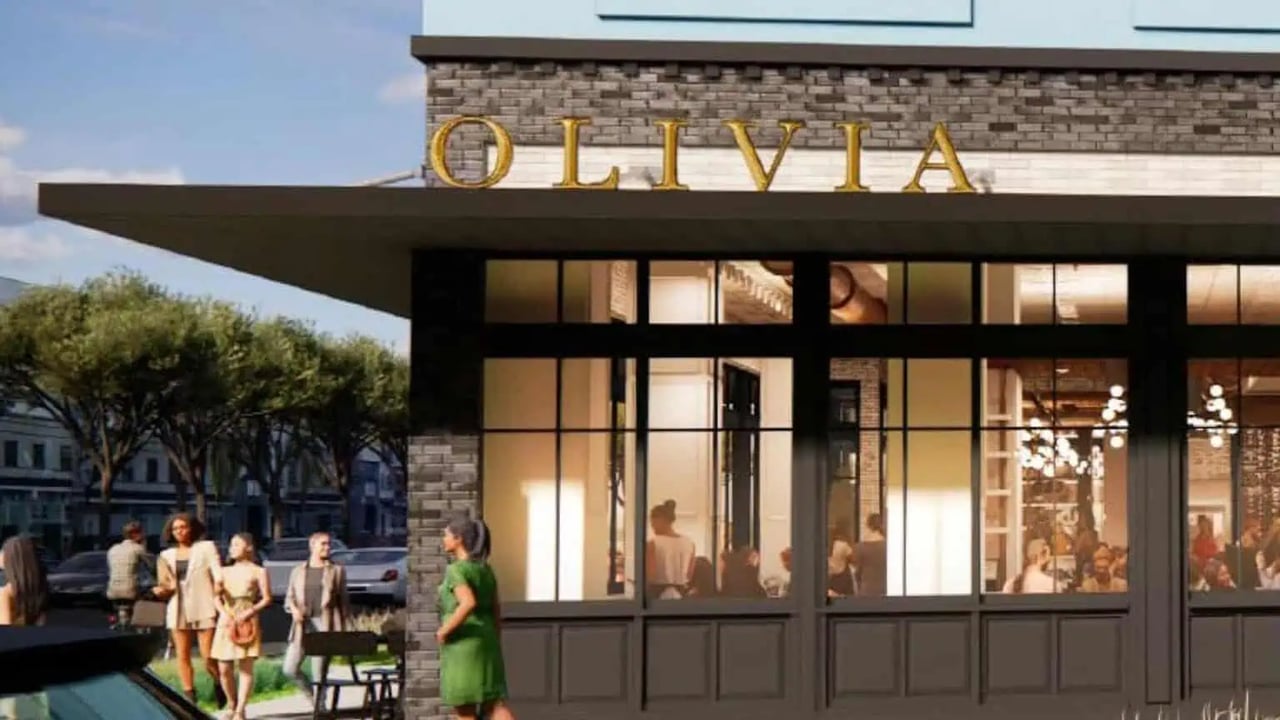 Olivia Italian restaurant exterior with gold lettering and a glass-fronted dining room.