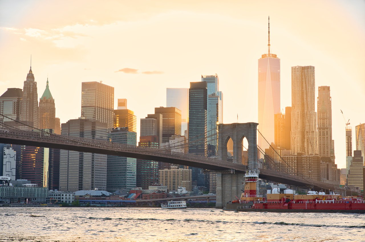 One Brooklyn Bridge Park luxury condominium building located at 360 Furman Street in Brooklyn Heights overlooking Brooklyn Bridge Park, the East River, and the Manhattan skyline.