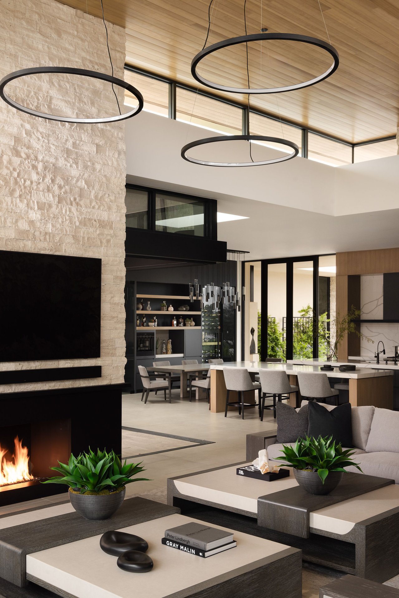 Modern luxury home in Paradise Valley with resort-style backyard, pool, fire feature, and contemporary architecture at sunset.