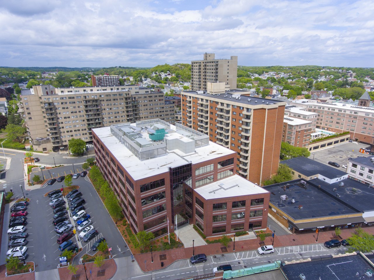 Aerial view of Malden with mid-rise buildings and leafy neighborhoods.