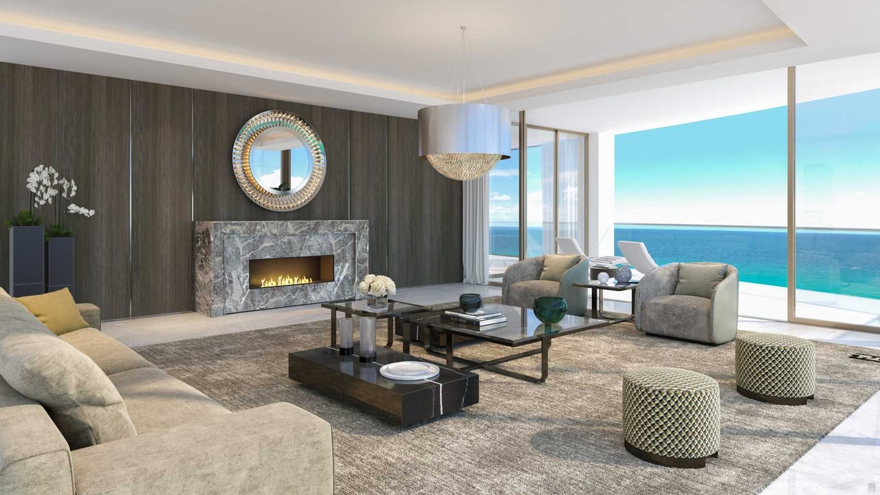 The Estates at Acqualina living room with fireplace 