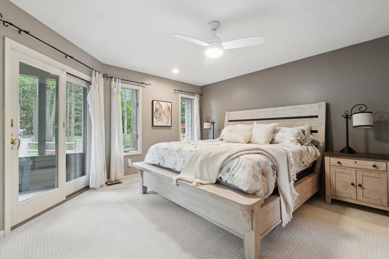 Inviting bedroom in walkout basement wooded