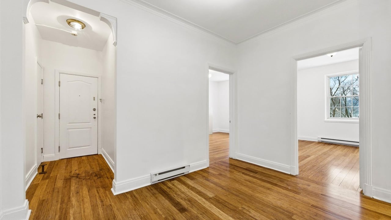 At the edge of Westmount | Corner unit with a view of Mount Royal
