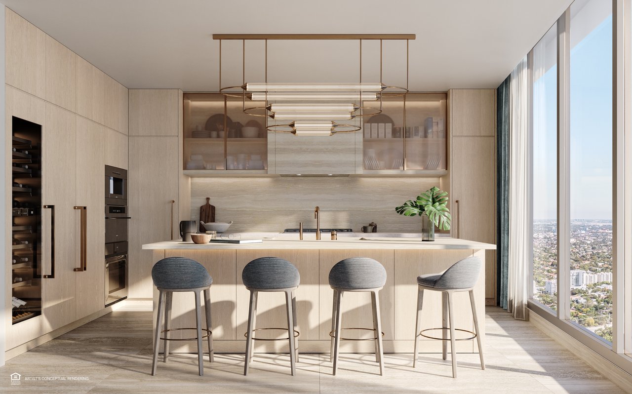 Modern kitchen with a large island, four stools, pale wood cabinetry, and floor-to-ceiling windows overlooking Miami.