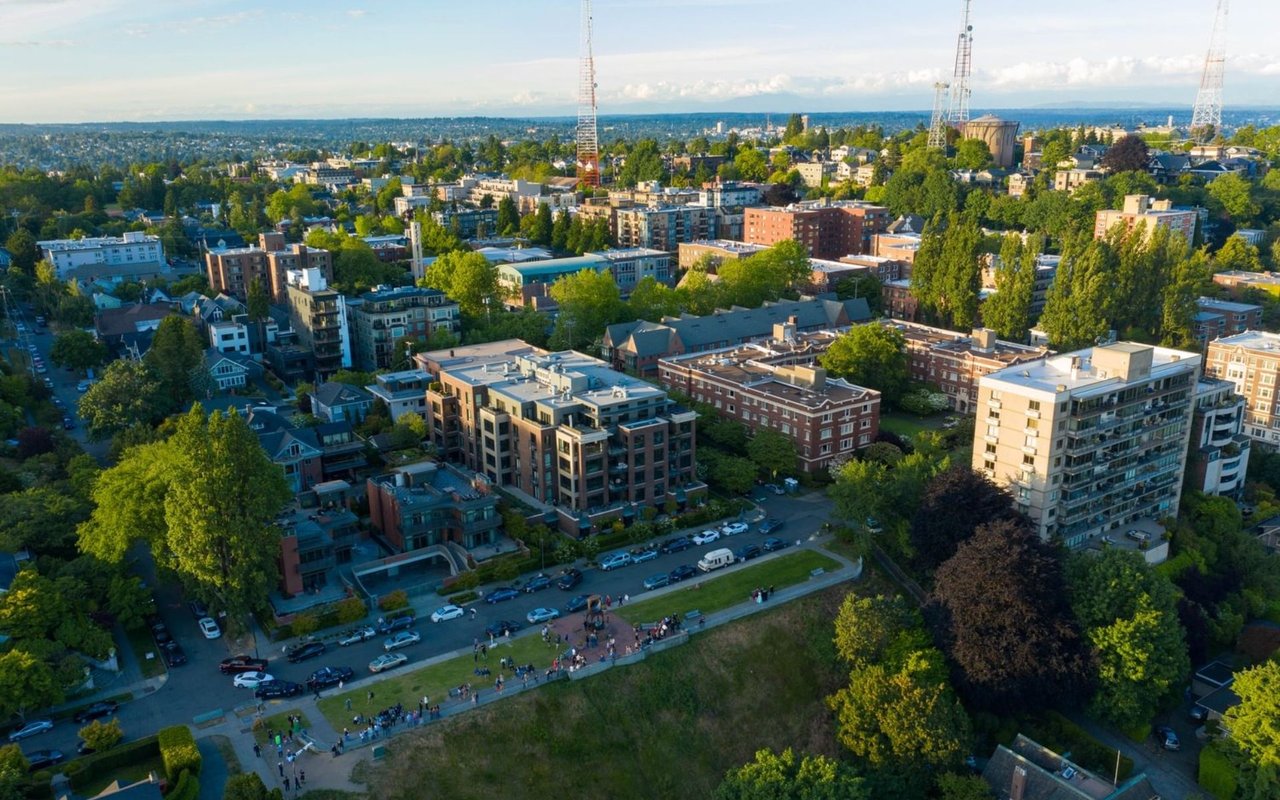 Aerial view of Queen Anne with leafy streets, apartment buildings, and a grassy open space.