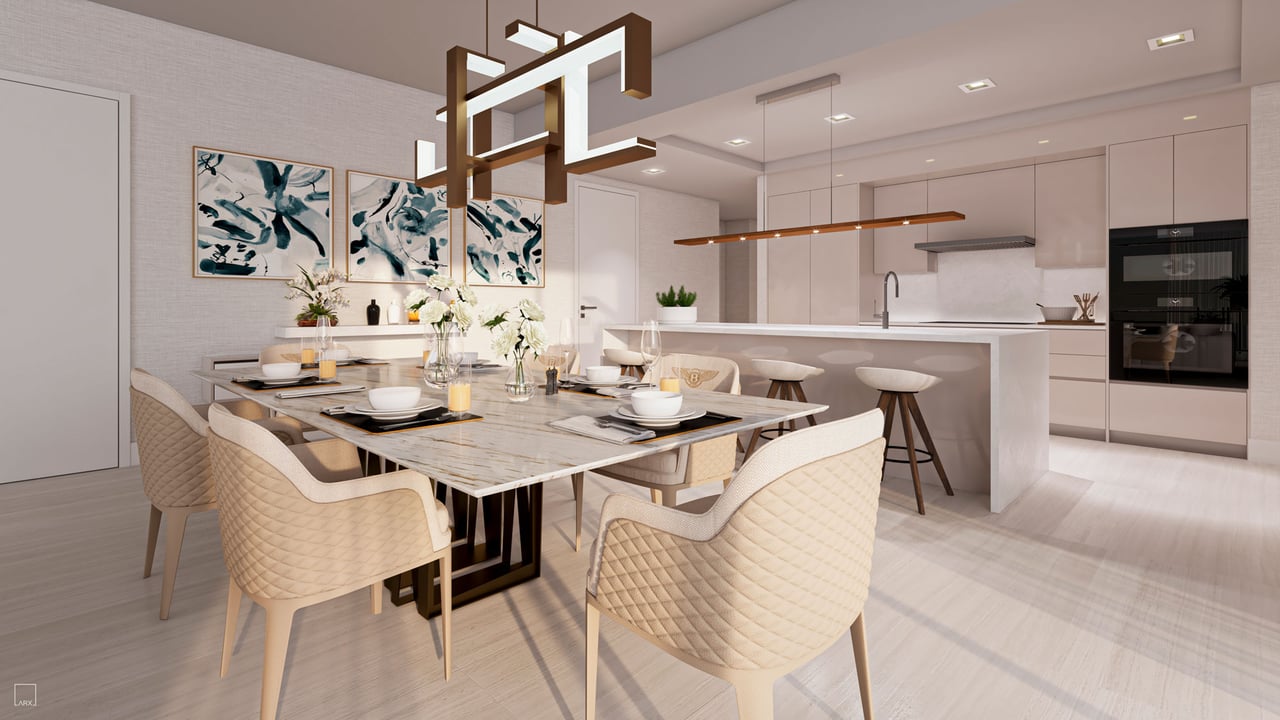 Open-plan kitchen and dining area with a stone island and quilted cream dining chairs.