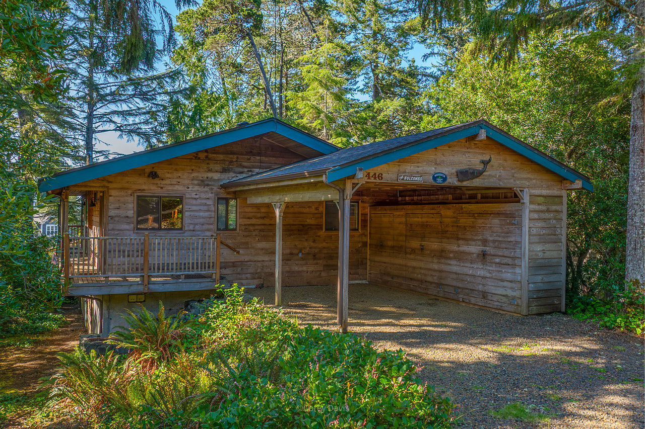 Sold classic beach cabin at 446 Ocean Ave in Manzanita Oregon surrounded by trees