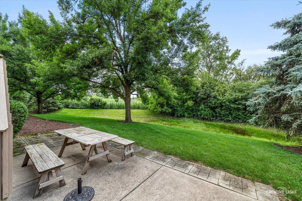Deck leading down to a private patio backing to wildlife at 2137 Prairie Lane Woodridge IL