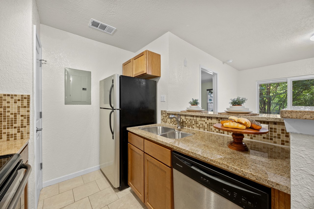 Top-Floor Condo Retreat in Gated Ivy Condos | Private Balcony + Tree-Filled Views