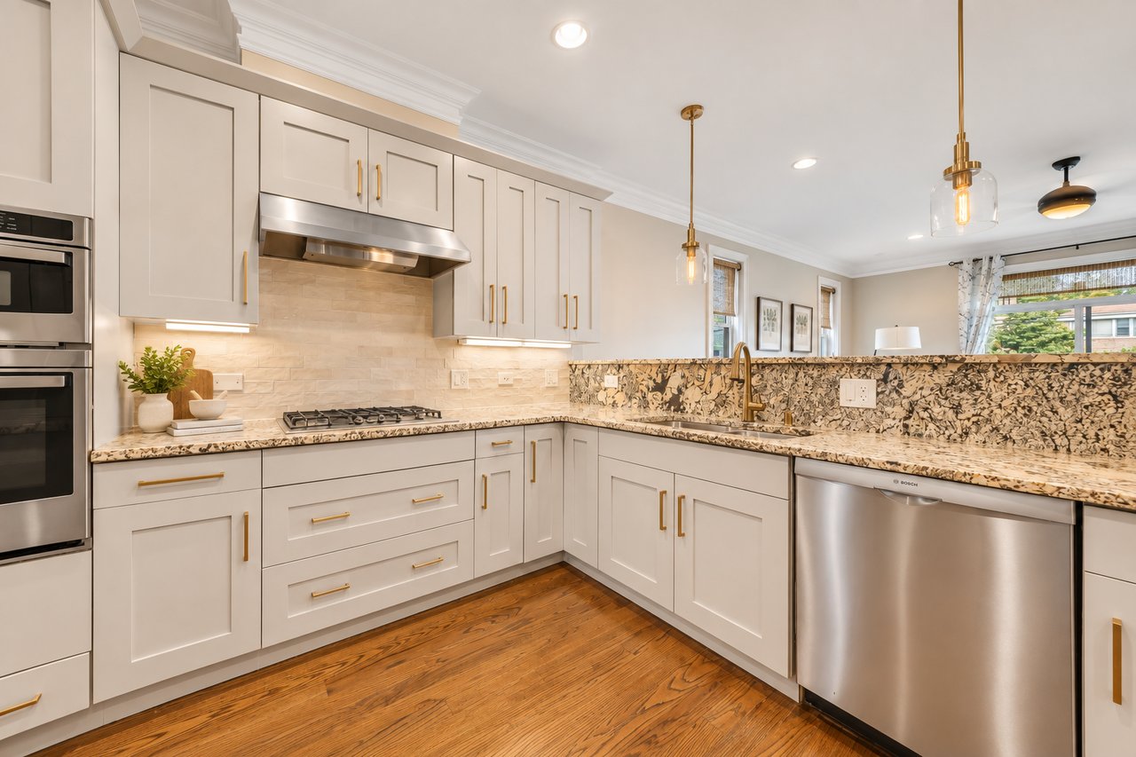 Kitchen at 4319 N Richmond St #1N with white cabinets and granite counters