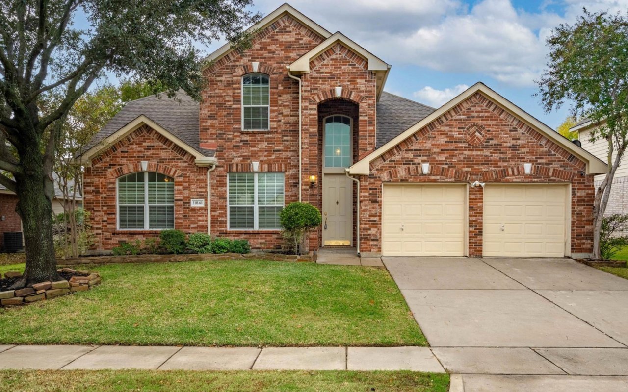 Front exterior of 11841 Moorhen Cir, Fort Worth TX — spacious Keller ISD home with brick facade, landscaped yard, and oversized driveway in Alliance real estate area