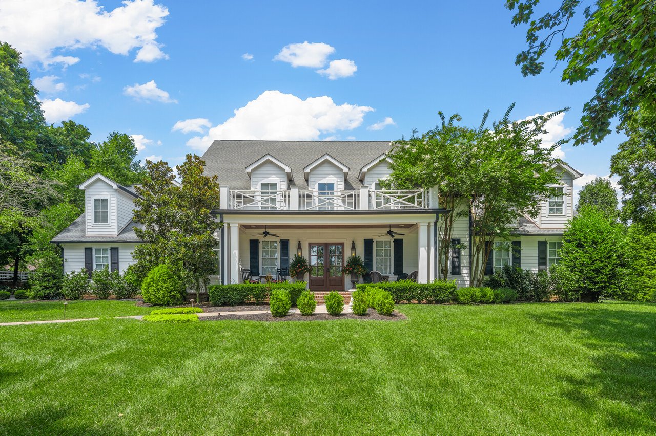Wide view of 5566 Hill Rd, Brentwood — lawn and double-porch façade