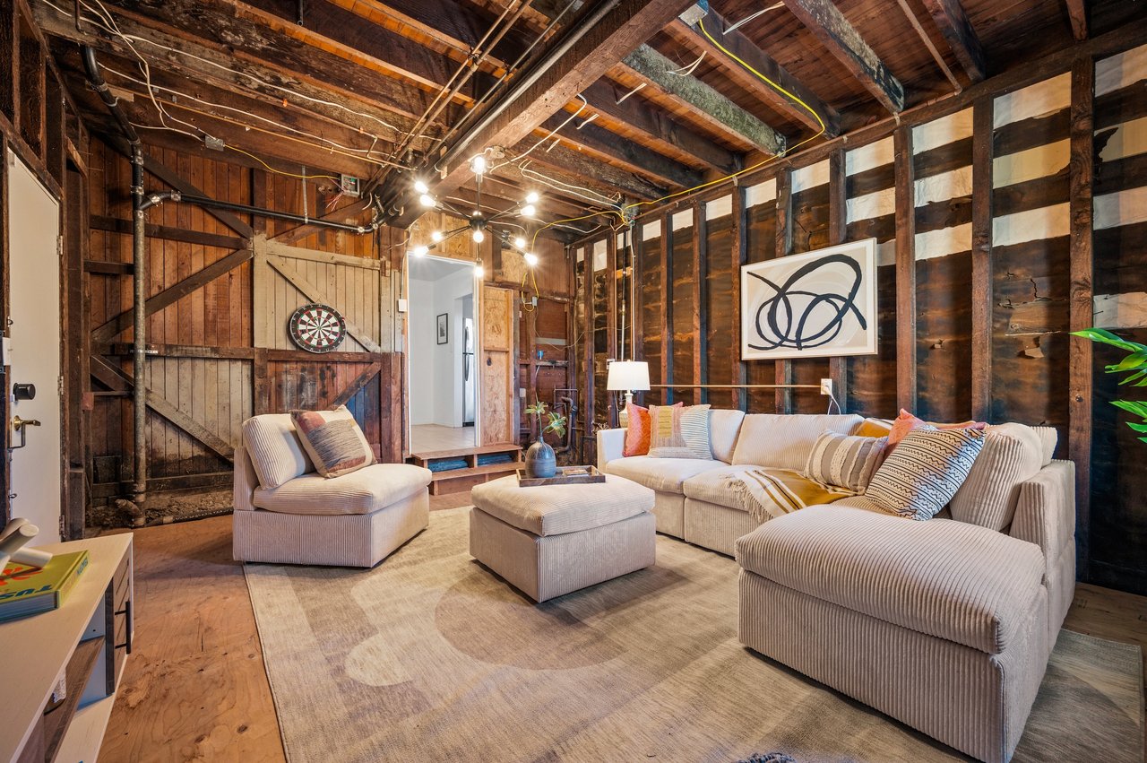 Real estate agent negotiating home offer terms with listing agent in a modern San Francisco office