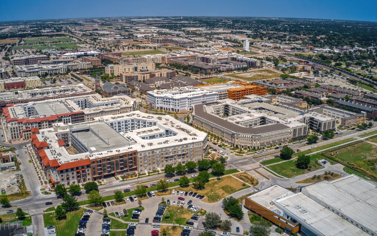 Aerial view of Frisco’s mid-rise buildings, shops, and streets.