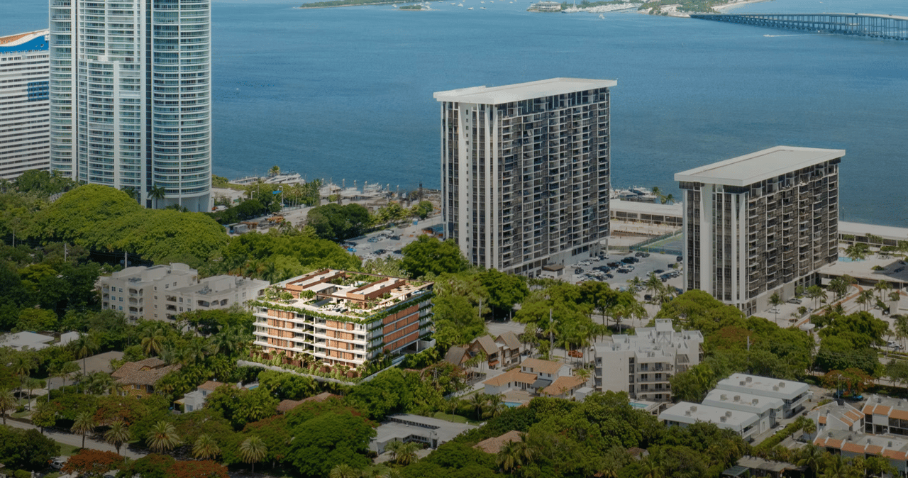 Aerial rooftop view of Colette Residences featuring rooftop pools, lush terraces, outdoor lounge areas, and panoramic Miami skyline views.