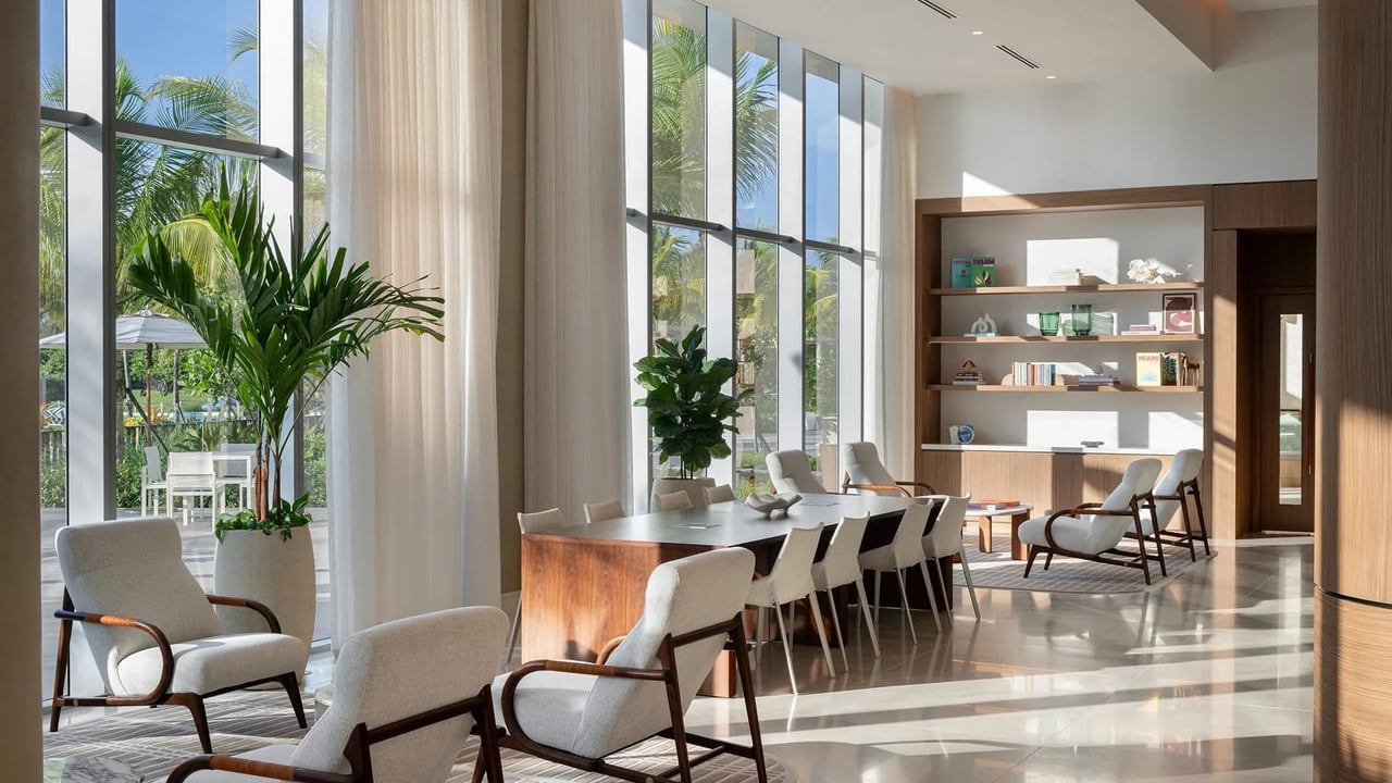 ONE Park Tower Laguna Lounge with seating and floor-to-ceiling windows.
