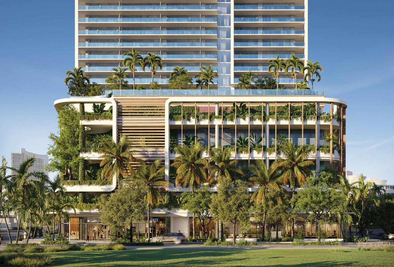 Miami Tropic Residences tower with glass balconies, a planted terrace, palm trees, and retail frontage.