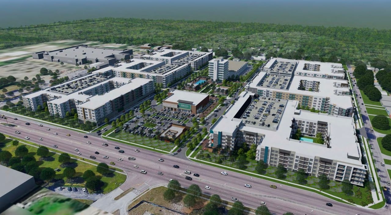 Aerial rendering of the Sky Town apartment community, with multiple buildings, parking, and landscaped courtyards.