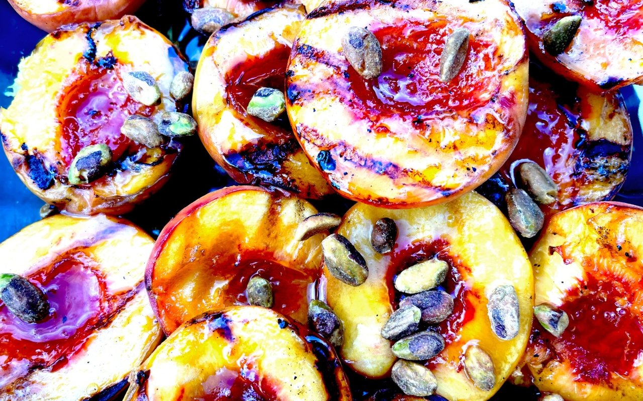 Grilled Peaches with Brown Sugar, Butter, Honey, and Pistachios