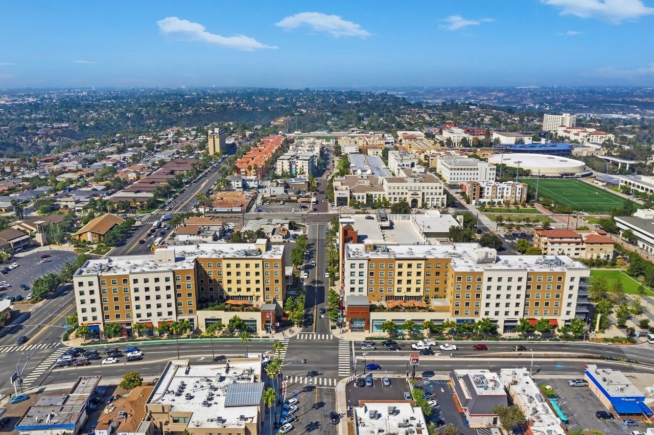 Aerial view of the College Area in San Diego featuring mid-rise apartments, SDSU campus, and residential streets—highlighting central real estate with rental potential.