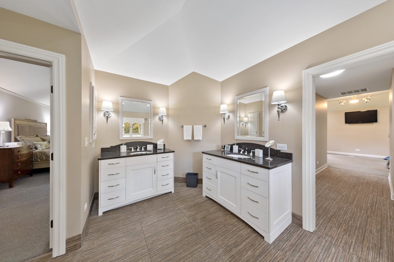 Beautifully Appointed Home in a Gated Community on Over an Acre of Professionally Landscaped Grounds with Pond Views