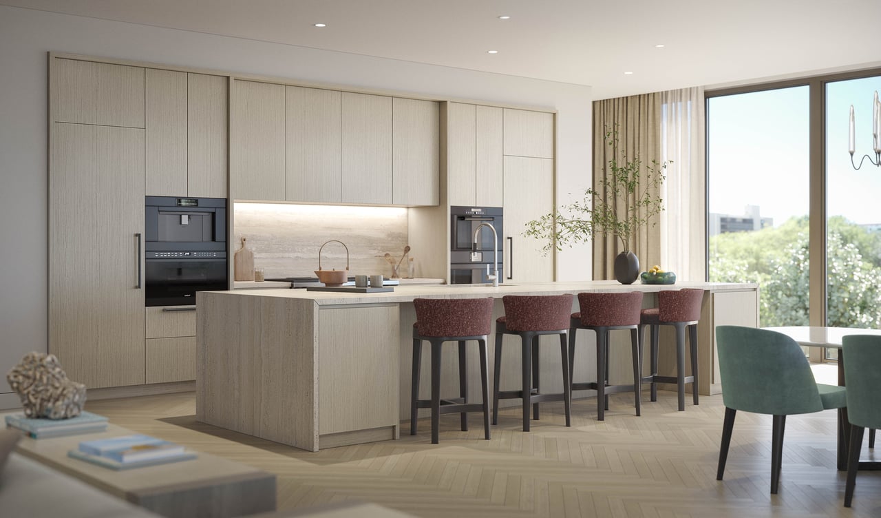 Modern condo kitchen with a large island, built-in appliances, and dining seating beside expansive windows.