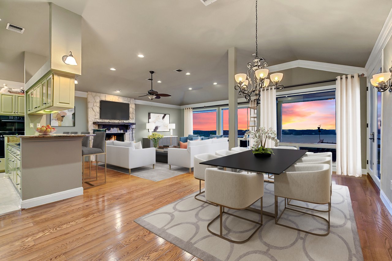 Open kitchen with a granite island opening to the dining area, with sunset views of Lake Travis, at 12709 Cedar St, Austin, TX 78732.