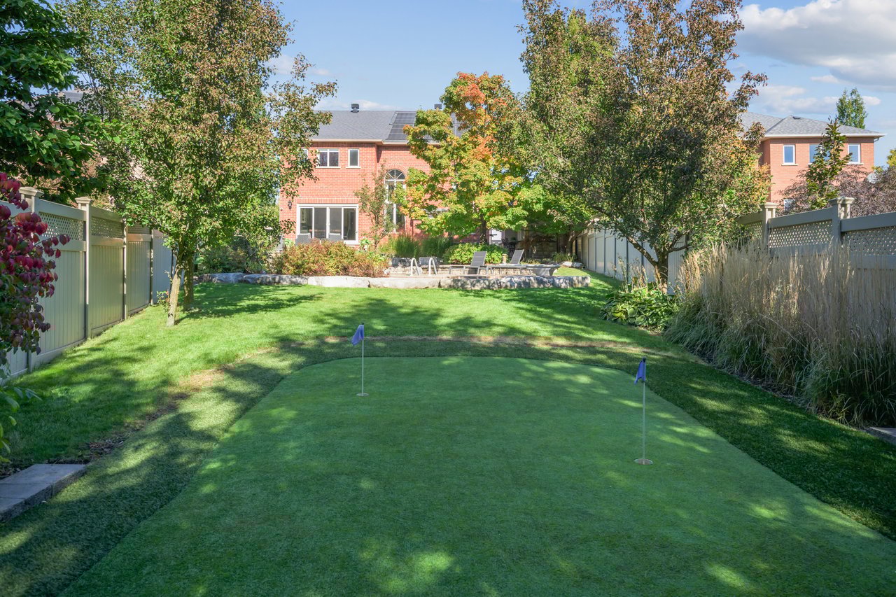 Resort-style yard backing onto lush ravine